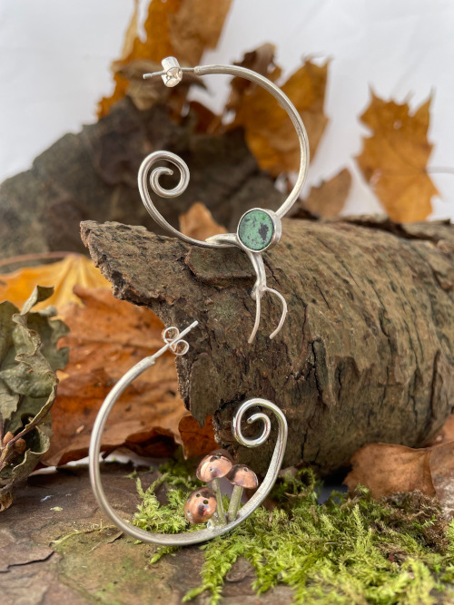 unfurling-fern-earrings.jpeg**Unfurling fern earrings**Large hoop sterling silver earrings depicting the unfurling of a young fern and decorated with my statement toadstools and snail. Finished with millefiori glass or gemstones. **1**1 	**170**,21,26,27,28,**,1,2,5,6,**